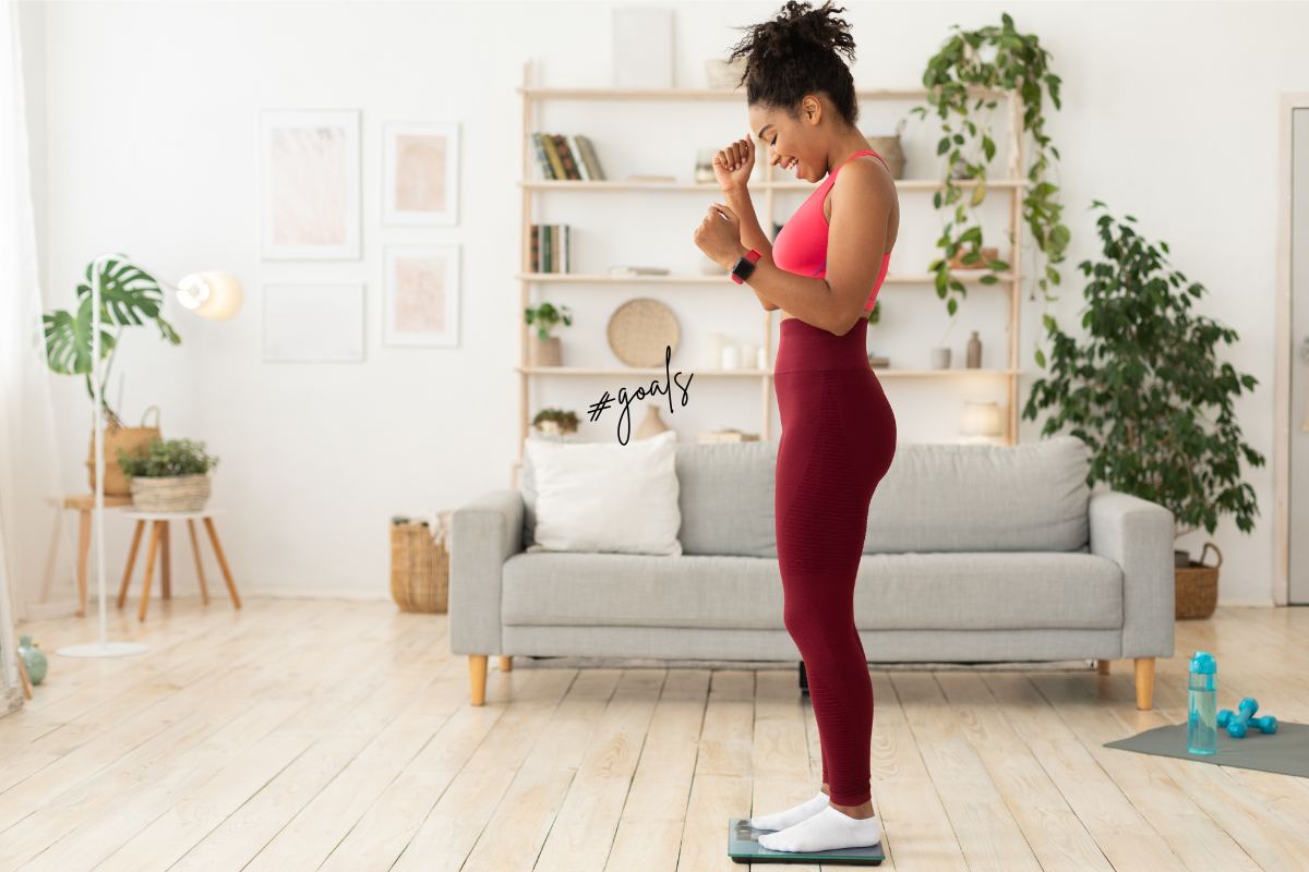 Woman on scale happy 1200x800px